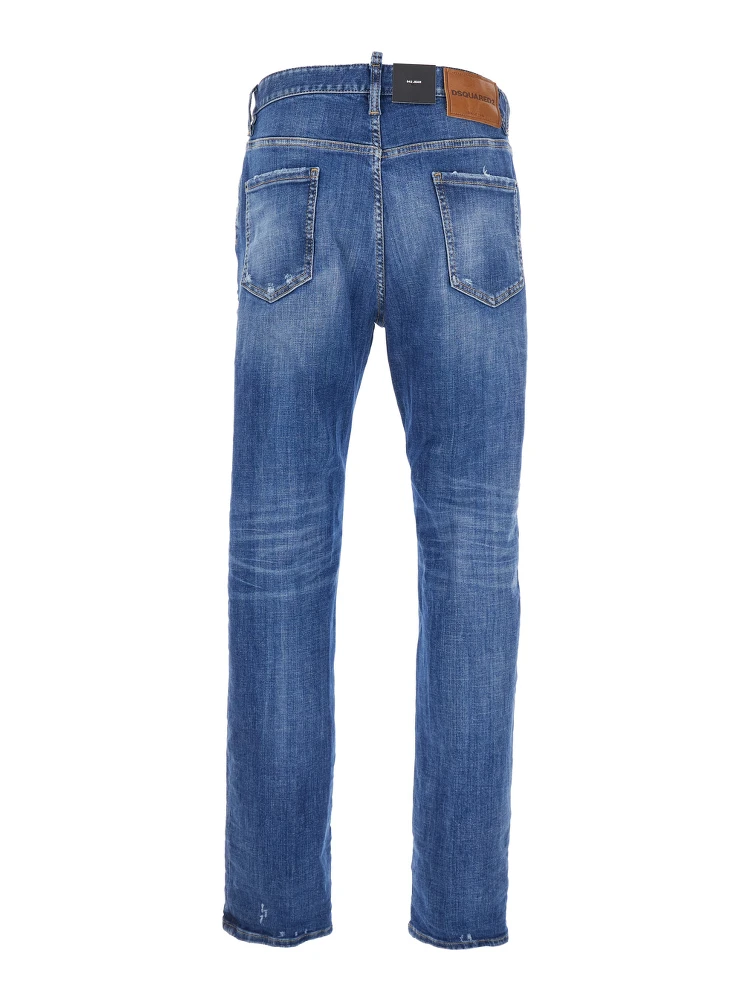 Blue Jeans with Ripped Details and Logo Patch on the Rear in Denim Man alternative