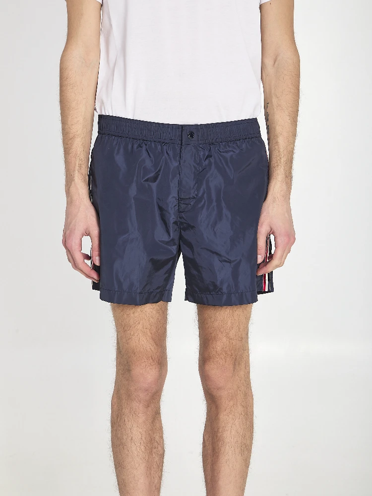 Swim shorts with a logo patch