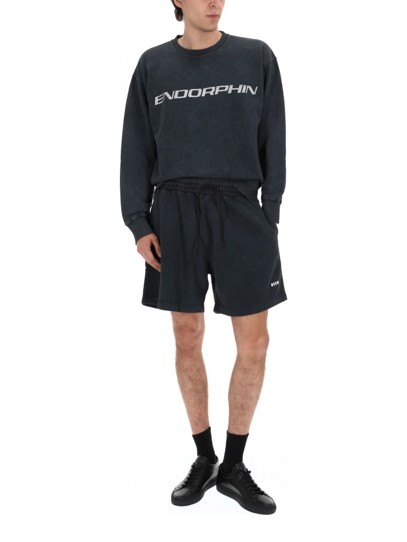 SHORTS CON LOGO