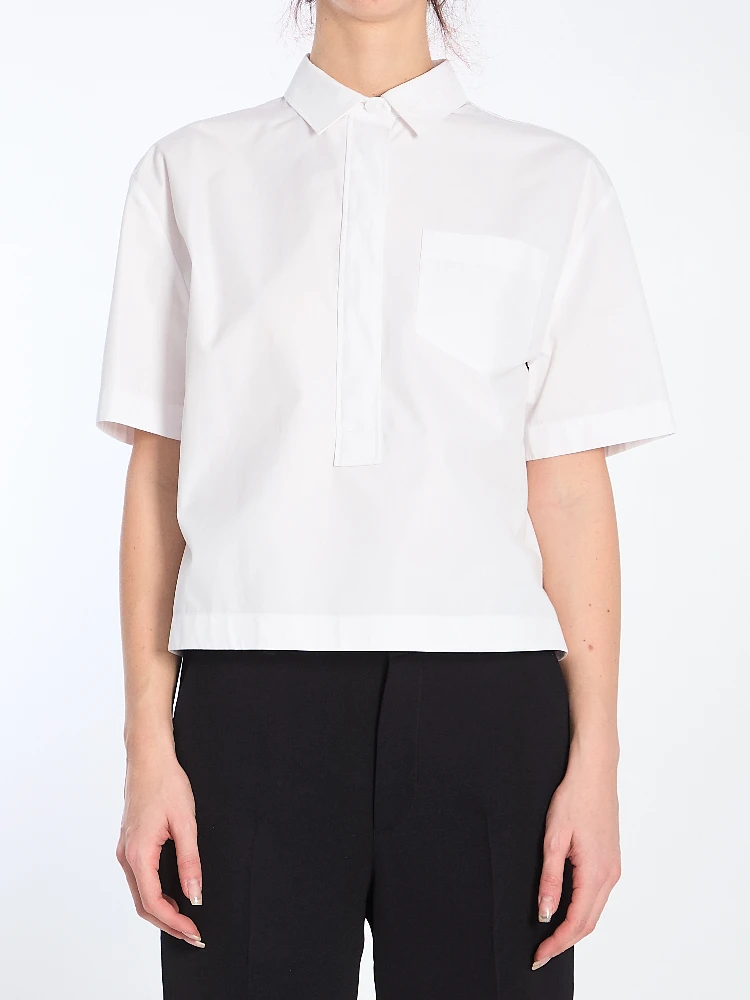 Shirt with embossed logo